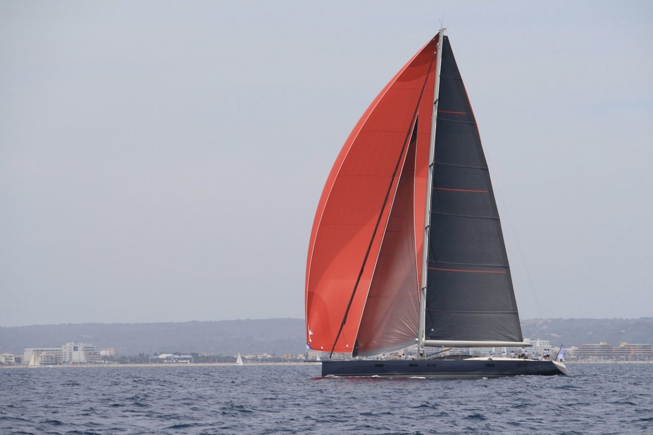 Super yacht flying black Lion Sailing sails