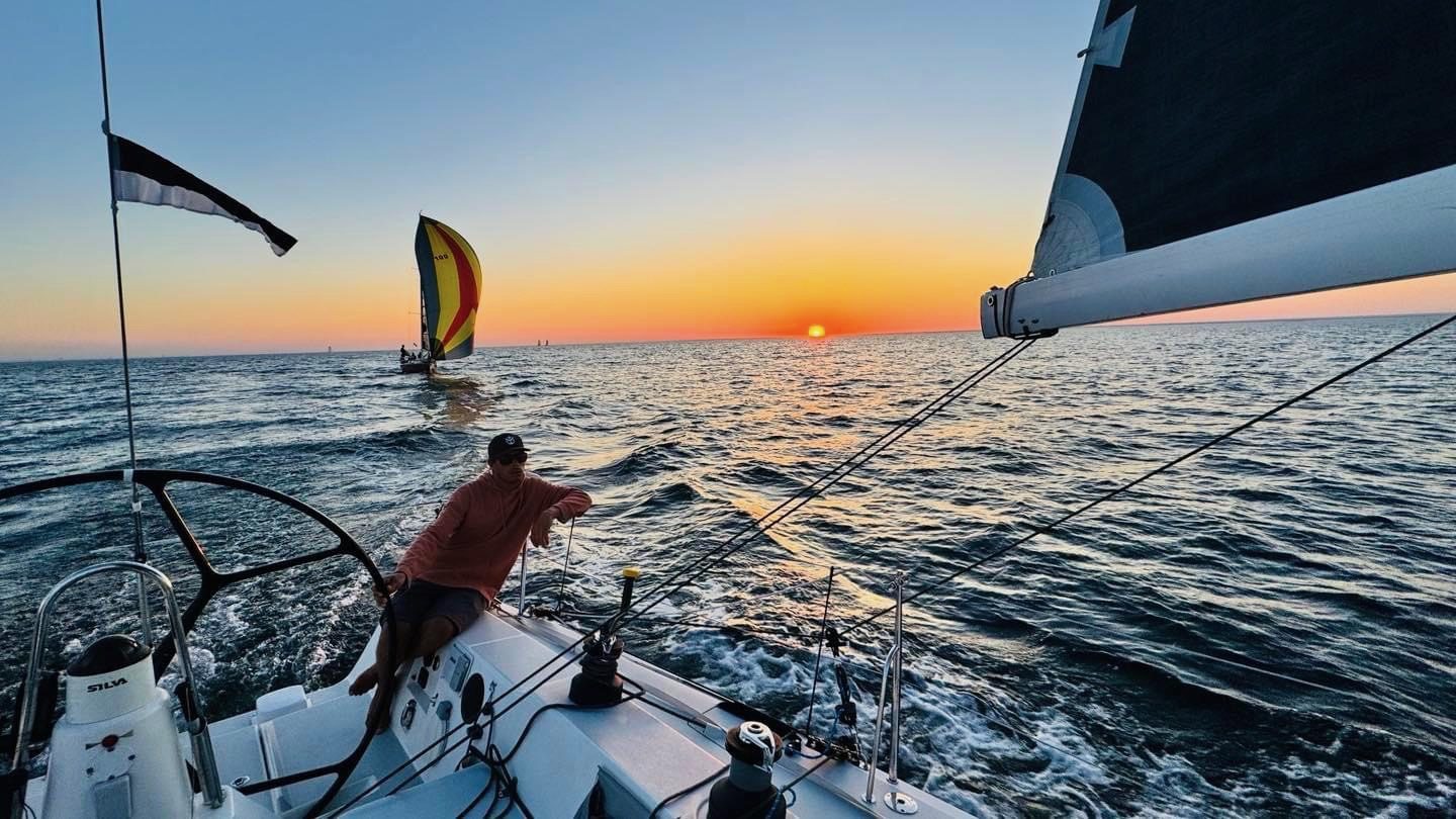 Offshore passage at sunset under Lion sails