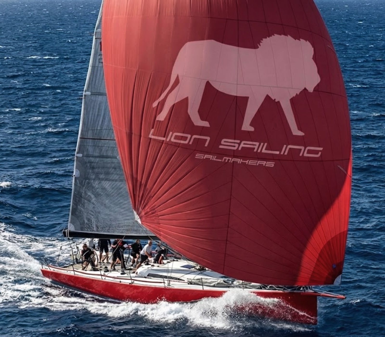 Lion Sailing red spinnaker
